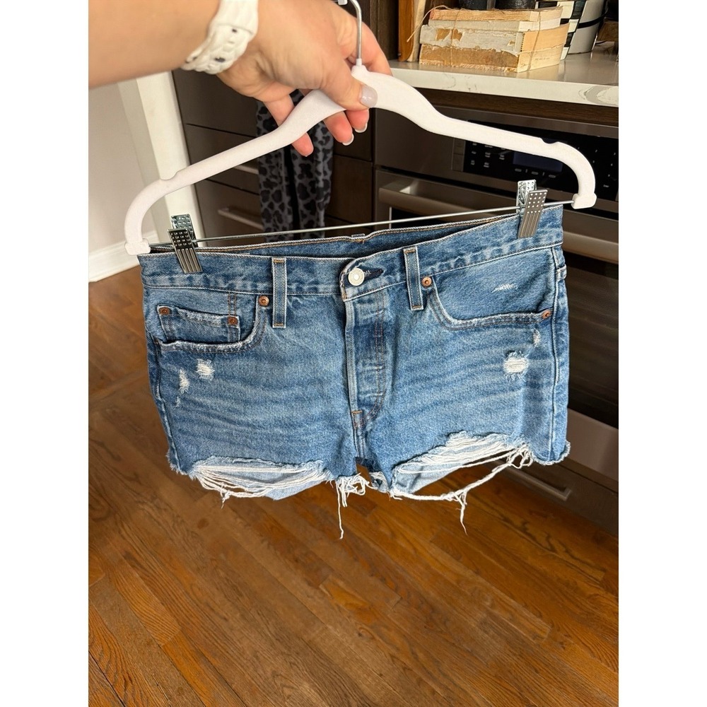 Levi's 501 Original Shorts in a distressed medium wash size 29